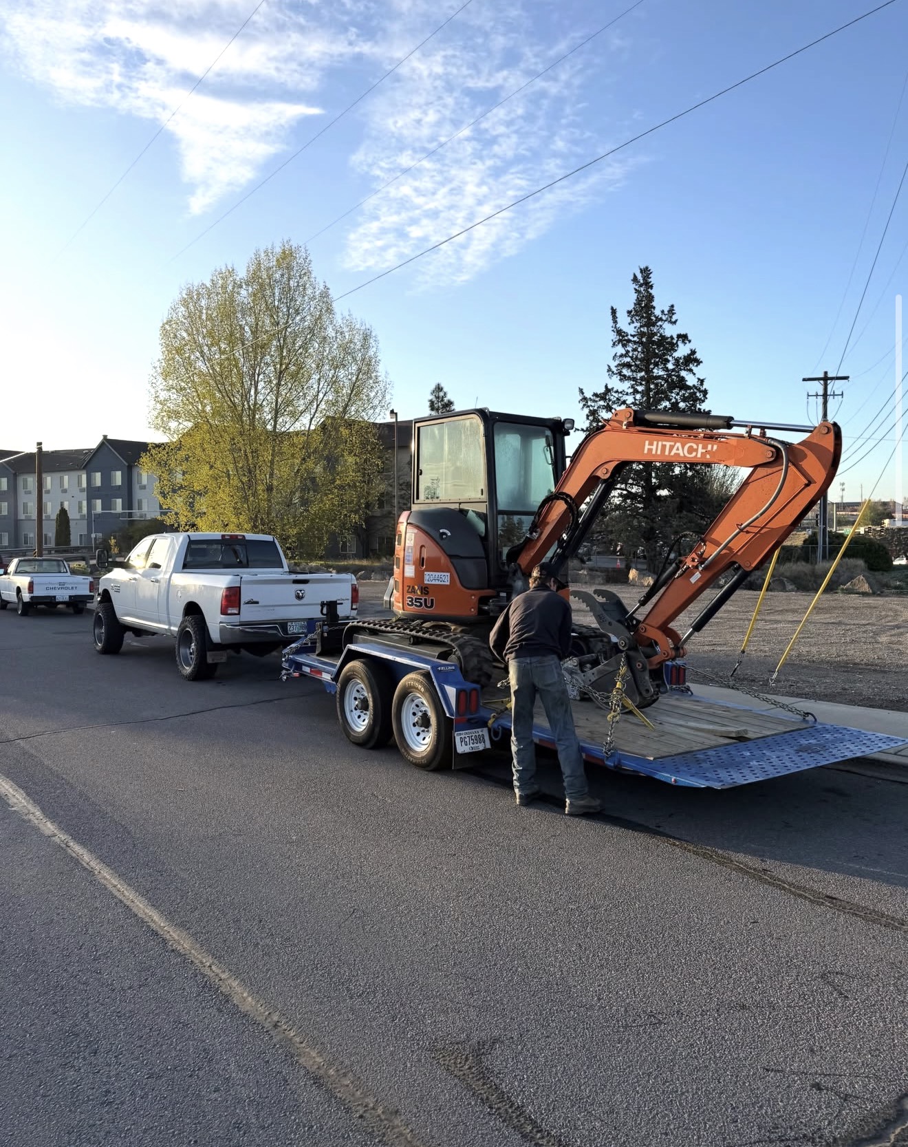 Excavator being hauled
